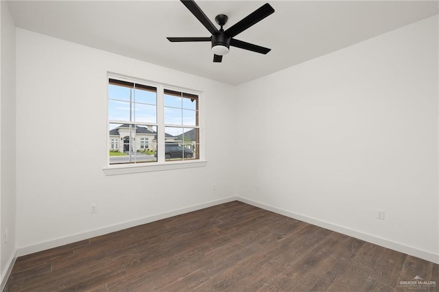 unfurnished room with dark hardwood / wood-style flooring and ceiling fan