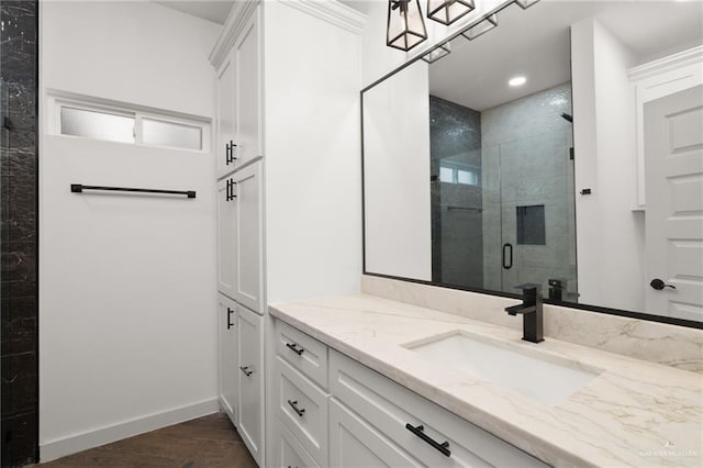 bathroom featuring a shower with door, vanity, and wood-type flooring