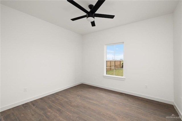 spare room featuring ceiling fan and dark hardwood / wood-style floors