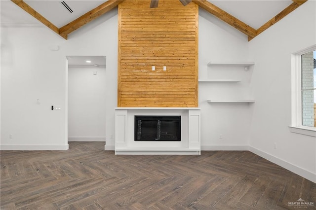 unfurnished living room with high vaulted ceiling, dark parquet flooring, a fireplace, and beamed ceiling