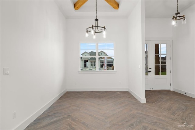 unfurnished dining area with dark parquet flooring, a chandelier, and a high ceiling