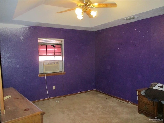 carpeted empty room featuring ceiling fan and cooling unit