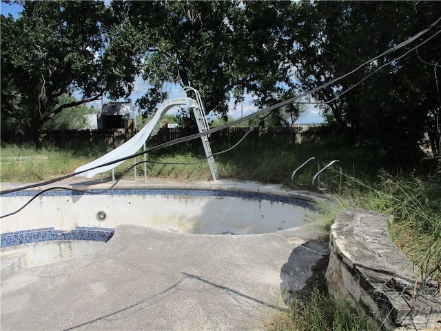 view of pool featuring a water slide