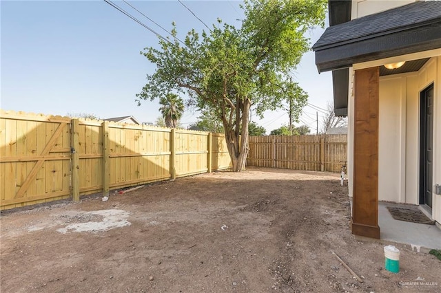 view of yard with a fenced backyard