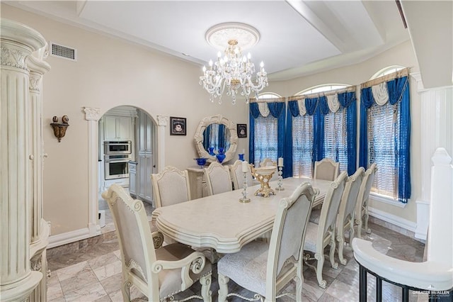 dining room featuring a notable chandelier