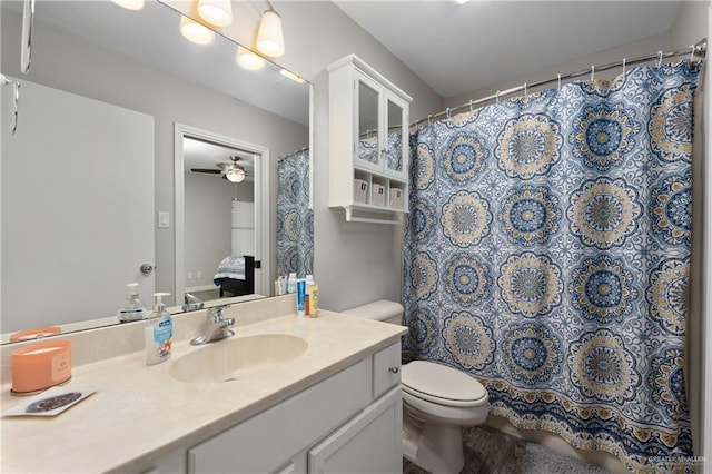 bathroom featuring vanity, ceiling fan, and toilet