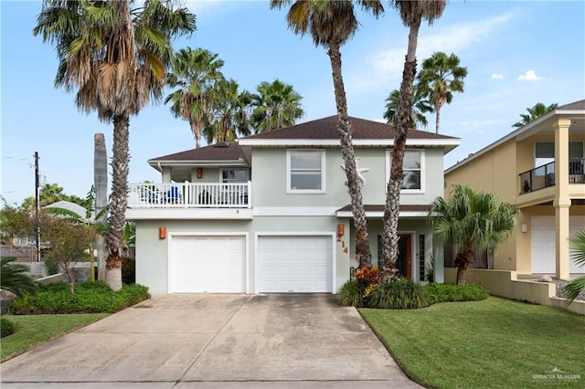 view of front of property featuring a garage and a front yard