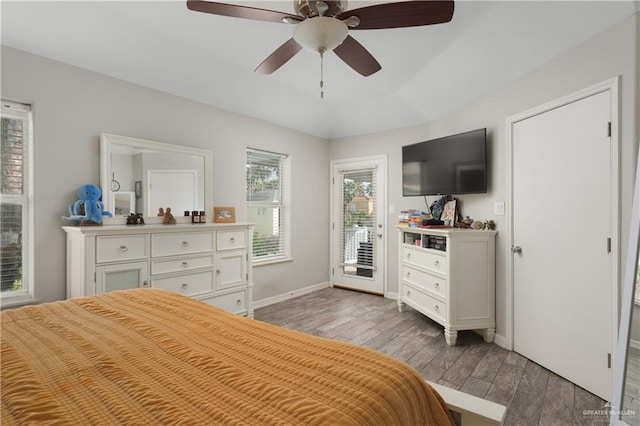 bedroom with ceiling fan, access to exterior, and light hardwood / wood-style flooring