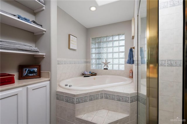 bathroom with tiled bath