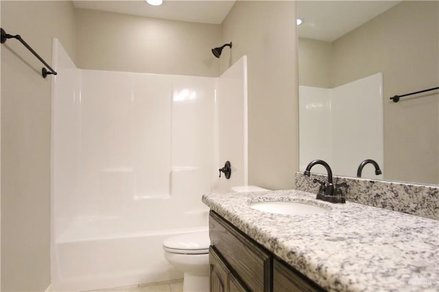 full bathroom featuring tile patterned floors, vanity, toilet, and tub / shower combination