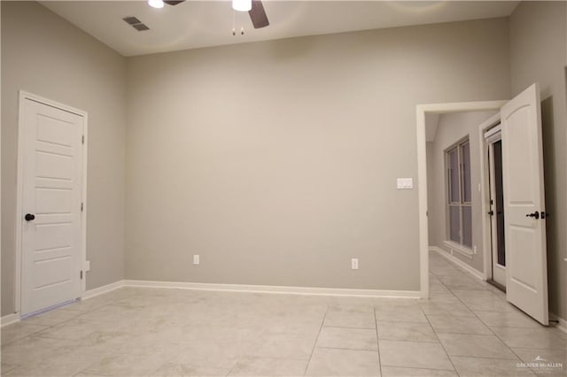 unfurnished room featuring light tile patterned floors and ceiling fan