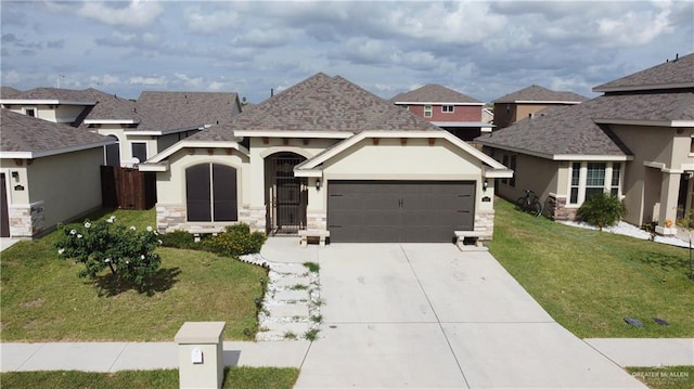 view of front of house with a front lawn and a garage