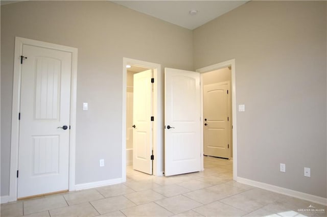 unfurnished bedroom featuring light tile patterned flooring