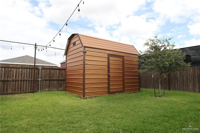 view of outbuilding with a lawn