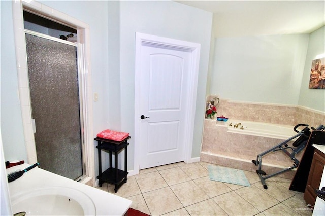 bathroom with tile patterned flooring, vanity, and independent shower and bath