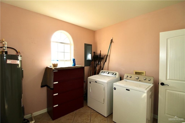 washroom with independent washer and dryer, electric water heater, and light tile patterned flooring