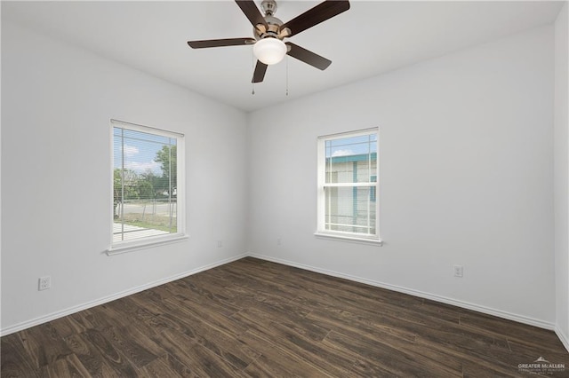 empty room featuring dark hardwood / wood-style floors and ceiling fan