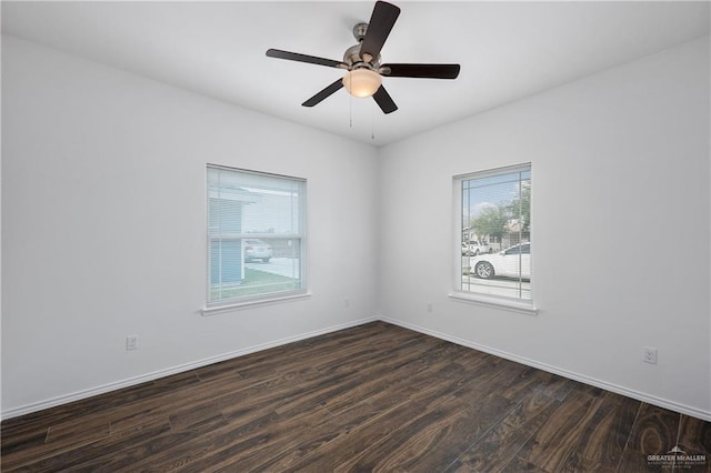 unfurnished room featuring ceiling fan and dark hardwood / wood-style flooring