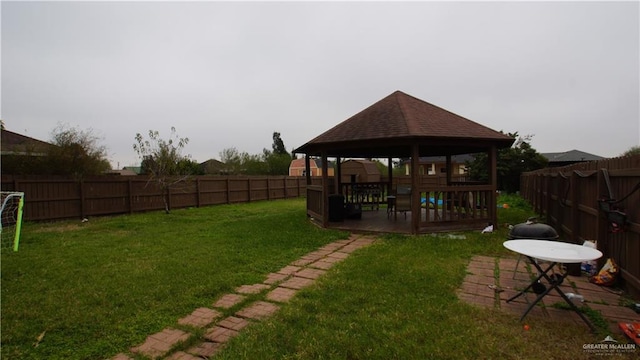 view of yard with a wooden deck and a gazebo