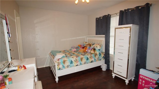 bedroom with dark wood-type flooring