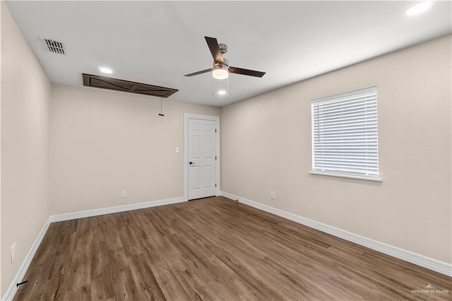 1018 N Keralum Ave, Mission, TX 78572 - empty room featuring attic access, ceiling fan, wood finished floors, baseboards, and recessed lighting