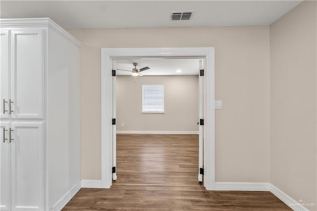1018 N Keralum Ave, Mission, TX 78572 - hall featuring baseboards and wood finished floors