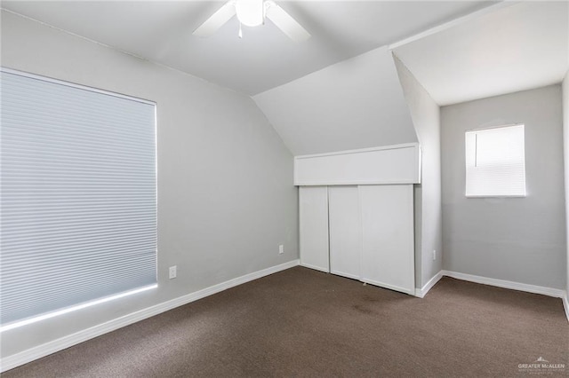 7201 S San Marcos St, Pharr, TX 78577 - unfurnished bedroom featuring dark carpet, a closet, baseboards, lofted ceiling, and ceiling fan