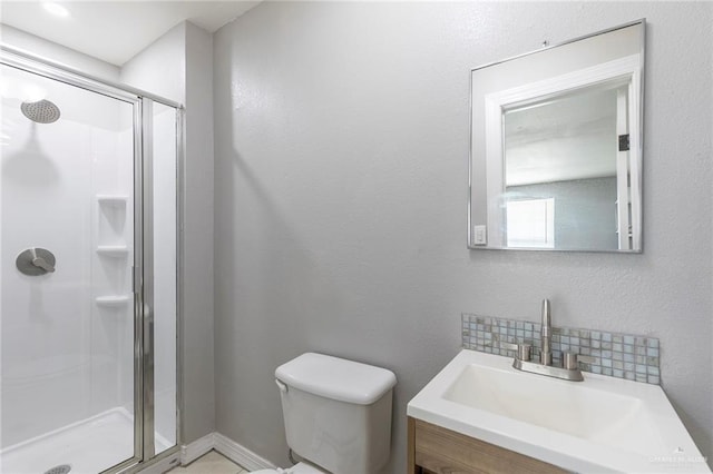 7201 S San Marcos St, Pharr, TX 78577 - bathroom featuring a stall shower, vanity, and toilet