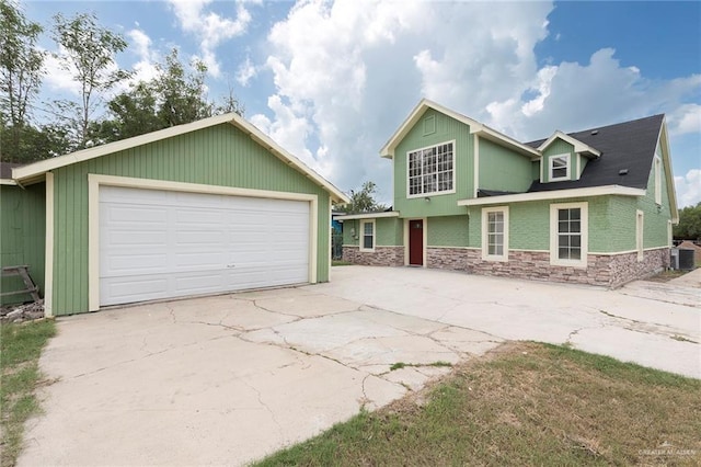 7201 S San Marcos St, Pharr, TX 78577 - view of front of home with stone siding, a garage, an outbuilding, and central AC