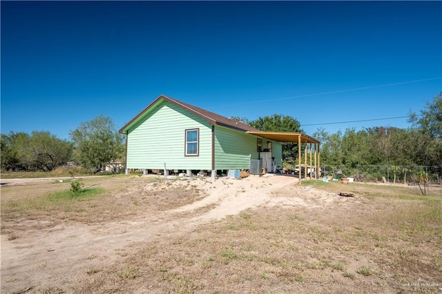 exterior space with a carport