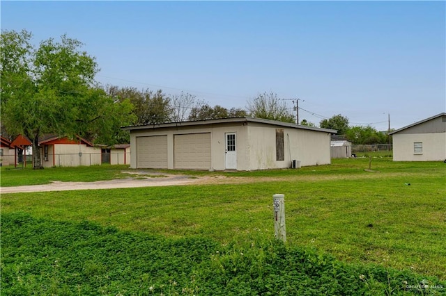 garage featuring a yard