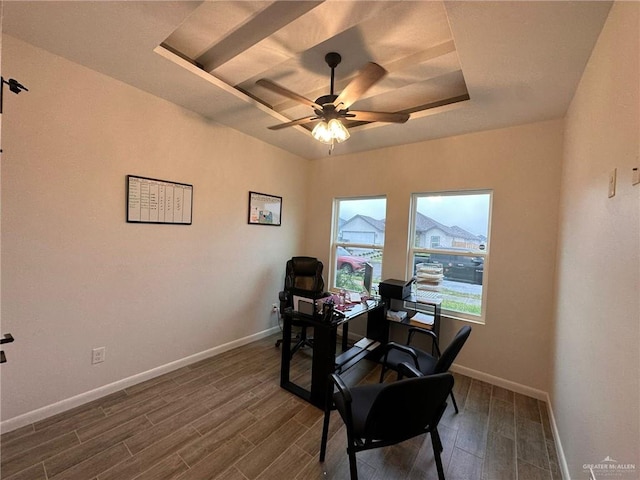 office featuring a raised ceiling and ceiling fan