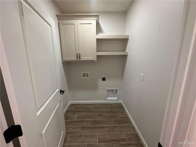 washroom with cabinets, hookup for a washing machine, and electric dryer hookup