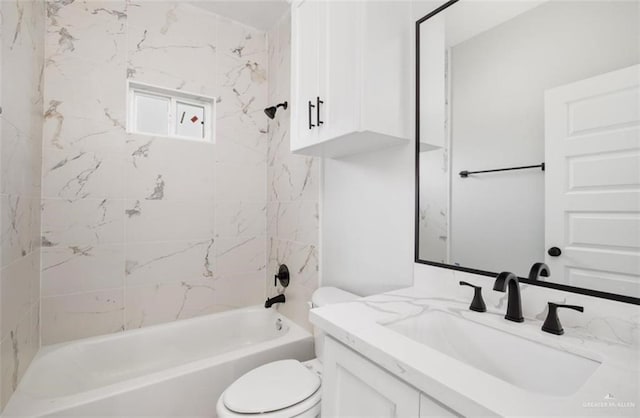 full bathroom with vanity, toilet, and tiled shower / bath