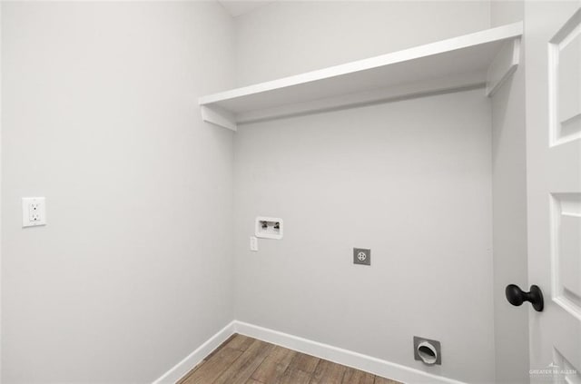 clothes washing area with hookup for a washing machine, wood-type flooring, and hookup for an electric dryer