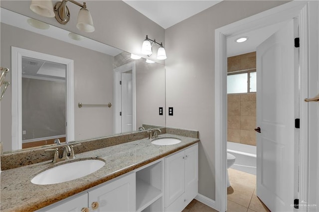 bathroom featuring tile patterned flooring, vanity, and toilet