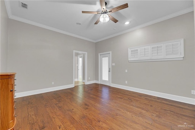 spare room with crown molding, ceiling fan, and wood-type flooring