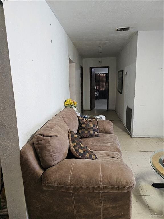 living room with a textured ceiling