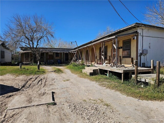 view of property exterior featuring a porch