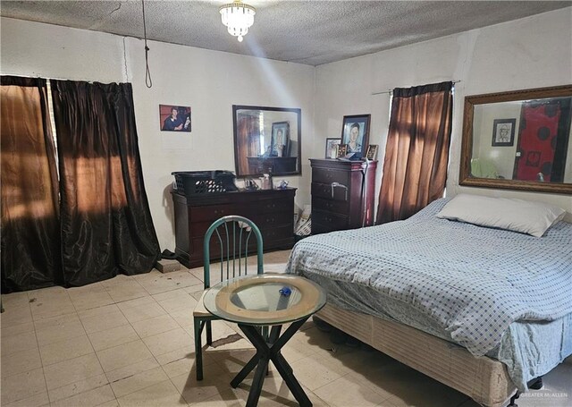 bedroom featuring a textured ceiling