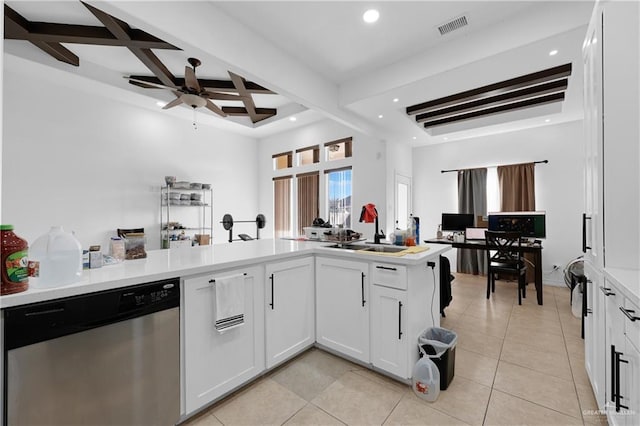 kitchen with white cabinetry, coffered ceiling, stainless steel dishwasher, and beam ceiling