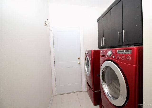 314 N 17th St, Hidalgo, TX 78557 - laundry area with washer and clothes dryer, cabinet space, light tile patterned flooring, and baseboards