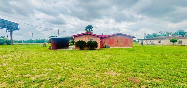 31665 US Highway 281, Edinburg, TX 78542 - view of side of home with brick siding and a yard