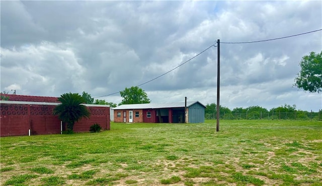31665 US Highway 281, Edinburg, TX 78542 - view of yard featuring fence and an outbuilding