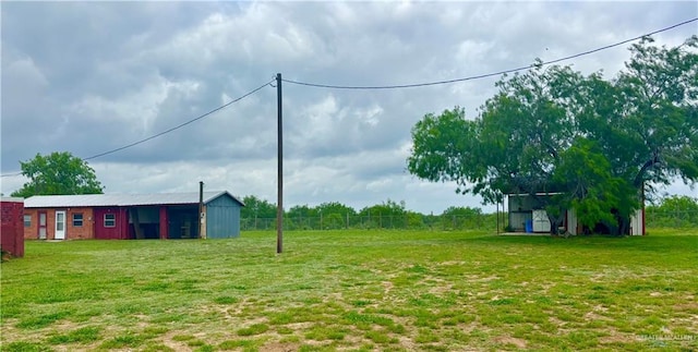 31665 US Highway 281, Edinburg, TX 78542 - view of yard with fence, an outbuilding, and a pole building