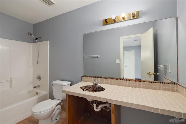 477 Serg Loop, Alamo, TX 78516 - bathroom featuring tasteful backsplash, toilet, shower / bathtub combination, visible vents, and vanity