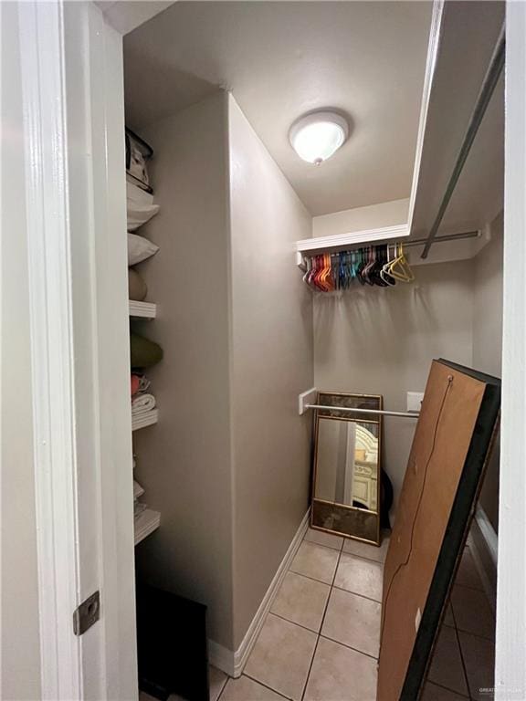 spacious closet featuring light tile patterned flooring