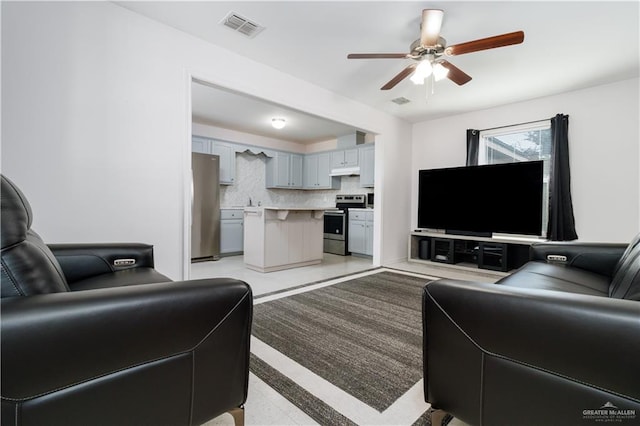 living room with ceiling fan