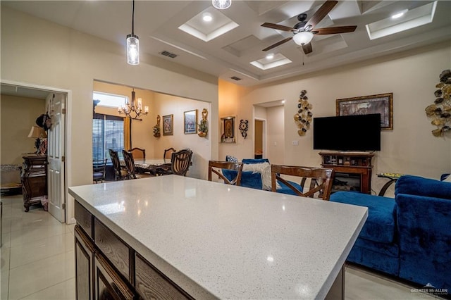 823 Sabrina Dr, Alamo, TX 78516 - kitchen featuring coffered ceiling, decorative light fixtures, open floor plan, a kitchen island, and a chandelier