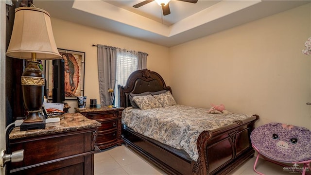 823 Sabrina Dr, Alamo, TX 78516 - bedroom featuring light tile patterned floors, a tray ceiling, and ceiling fan